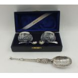 SEBASTIAN GARRARD A DECORATIVE SILVER ANNOINTING SPOON, cast handle, London 1920, 66g, together with