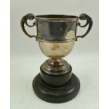A LATE VICTORIAN TWO HANDLED SILVER TROPHY CUP, with scroll handles, on circular platform foot,