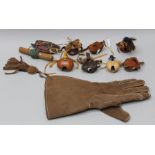 A COLLECTION OF FALCONRY ITEMS; a glove, a lure, seven hoods including a Syrian hood made by