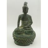 AN ARCHAIC CHINESE BRONZE BUDDHA in seated meditative pose, upon a lotus throne, possibly 7th to 9th