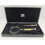 A DESK SET comprising a magnifying glass and letter opener, each with ribbed ivorine handle and