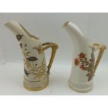 TWO ROYAL WORCESTER PORCELAIN TUSK JUGS, each with antler moulded handles, painted and gilded with