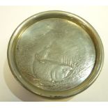 A WHITE METAL SPIRIT FLASK IN THE FORM OF A FISHING REEL, with engraved fishing scene panel,