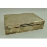 A MAPPIN & WEBB SILVER CIGARETTE BOX, having engine turned decoration 15.5cm