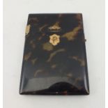 A 19TH CENTURY TORTOISESHELL VISITING CARD CASE, with yellow metal hinge, floral decoration and