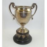 ADIE BROTHERS A TWO-HANDLED SILVER TROPHY CUP, having acanthus leaf and dolphin decorated handles,