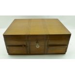 AN ART DECO OAK CASED CANTEEN OF CUTLERY FOR SIX PLACE SETTINGS, includes carving set etc., box 38.