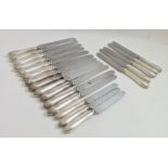 R.F. MOSLEY & CO. A SET OF TEN SILVER DINNER FORKS, having cast bell husk rim decoration, with