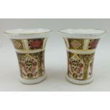 A PAIR OF ROYAL CROWN DERBY BONE CHINA POSY VASES of flared cylindrical form, decorated in the Imari