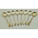 R.F. MOSLEY & CO. A SET OF EIGHT SILVER SOUP SPOONS, having cast bell husk rim decoration, each