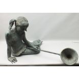 A LATE 20TH CENTURY BRONZE STATUE OF A GIRL, patinated, her hair in bunches holding a fishing net,