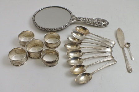 JOSIAH WILLIAMS & CO. A SET OF EIGHT SILVER TEASPOONS with feather cut edges, London 1916,