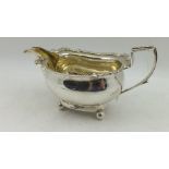 ROBERT & SAMUEL HENNELL A GEORGE III SILVER SAUCE BOAT, having decorative rim, gilded interior,