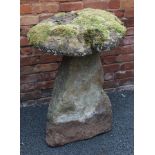 AN EARLY STADDLE STONE, having circular cap and tapering angular base, the base stands 88cm high,