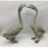 A PAIR OF LATE 20TH CENTURY BRONZE STATUES OF GEESE, patinated, 75cm high