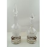 A PAIR OF "ASPREY" SILVER PLATED WINE BOTTLE COASTERS of Georgian design with turned wood bases,