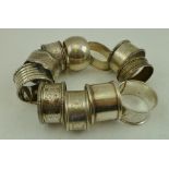 TWELVE VARIOUS SILVER NAPKIN RINGS, 230g.