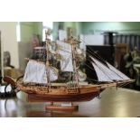 A SMALL SIZED WOODEN MODEL GALLEON