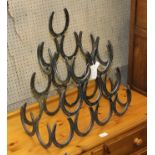 A DECORATIVE HORSESHOE DESIGN WINE RACK