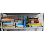 A SHELF FULL OF JIGSAW PUZZLES, various
