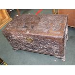AN ORIENTAL CARVED WOOD BLANKET CHEST, on short stubby cabriole legs, camphor wood lined, with