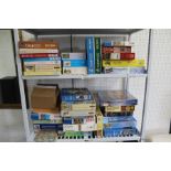 A SHELF FULL OF JIGSAW PUZZLES, various