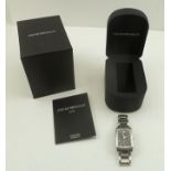 AN EMPORIO ARMANI UNISEX STAINLESS STEEL TANK STYLE WATCH, with original box and paperwork