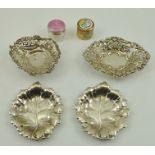 A PAIR OF SILVER LEAF DISHES, Birmingham 1972, TWO PIERCED SILVER DISHES, AN ENAMEL TOP JAR and a