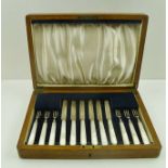 A SET OF SIX DESSERT KNIVES AND FORKS with mother of pearl handles, Sheffield 1932, cased
