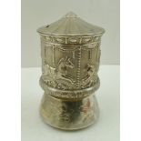 A MECHANICAL SILVER PLATED MONEY BOX fashioned as a "Merry-go-Round", 14cm high