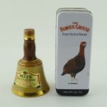ONE MINIATURE FAMOUS GROUSE (in tin), together with a MINIATURE BELL'S in a ceramic pottery