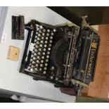AN EARLY 20TH CENTURY "UNDERWOOD" BRANDED MANUAL TYPEWRITER, together with a similar period HOLE