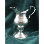 CHILD & CHILD A SILVER CREAM JUG of Georgian design, having crimped rim with scroll handle, on