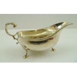 FRANCIS HOWARD LIMITED A GEORGIAN DESIGN MINT SAUCE BOAT, having gadrooned rim, acanthus leaf scroll