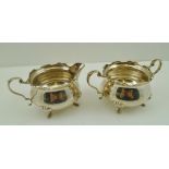 G.F. WESTWOOD & SONS A VICTORIAN DESIGN SILVER CREAM JUG AND SUGAR BOWL, each having decorative rim,