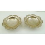 MAPPIN & WEBB A PAIR OF PETAL RIM SILVER SWEETMEAT DISHES, upon circular raised foot, Sheffield