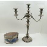 A SILVER PLATED TWIN BRANCH CANDELABRUM, 45cm high, together with an oval silver plated TABLE BOX