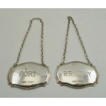 C. ROBATHAN & SON A PAIR OF SILVER GEORGIAN DESIGN STAMPED SPIRIT LABELS "Brandy" and "Port" on