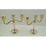 A.T. CANNON LIMITED A PAIR OF GEORGIAN DESIGN SILVER TWIN BRANCH CANDELABRA, having three nozzles,