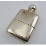 WILLIAM NEALE AN EARLY 20TH CENTURY SILVER HIP FLASK, with removable cup base, having gilded