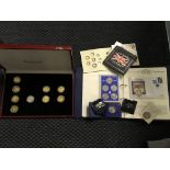 A collection of coins including royal commemorative coins.