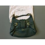 A Jimmy Choo green leather handbag with sack.