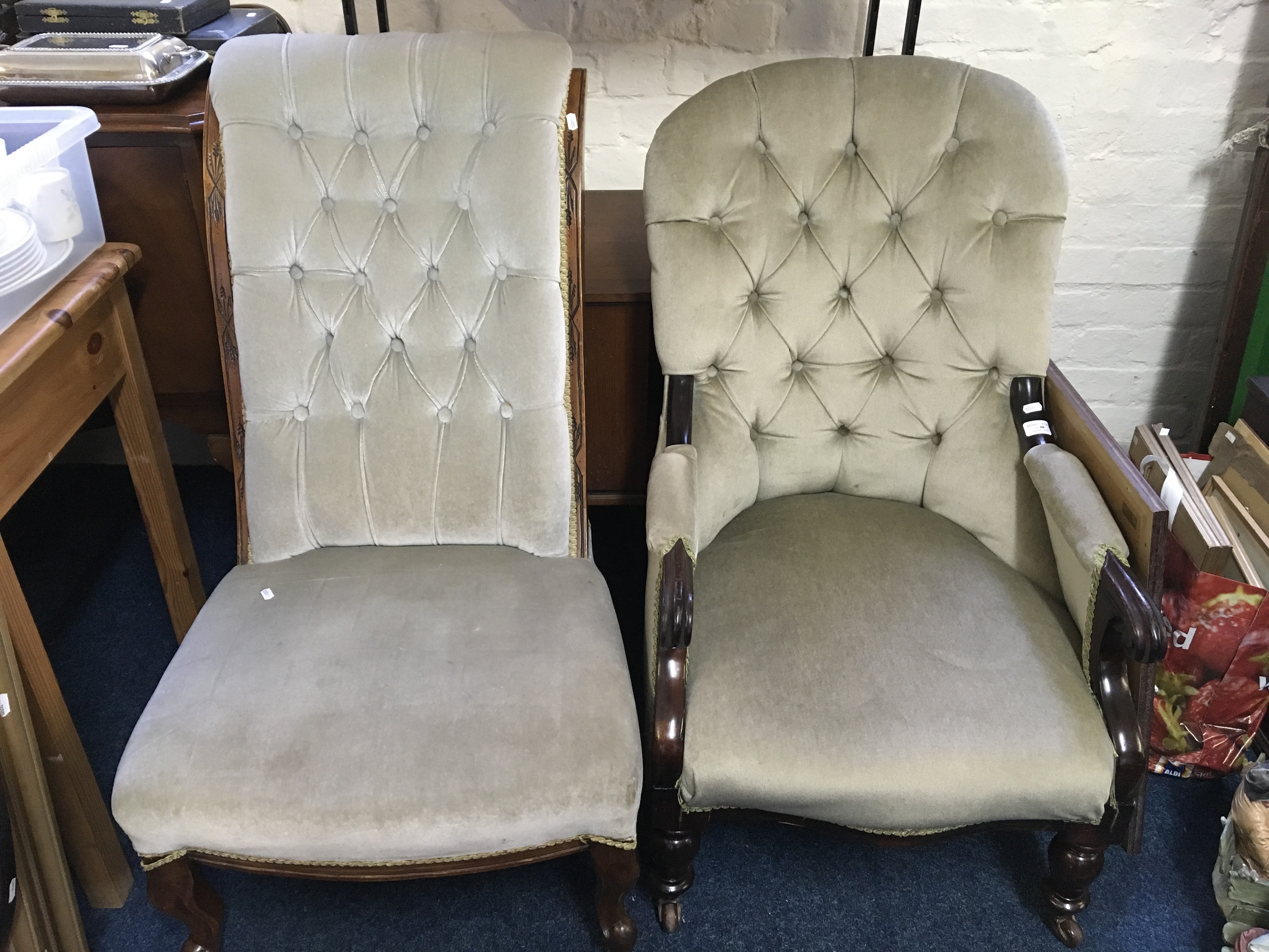 Two Edwardian green upholstered armchairs.