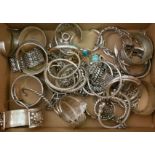 A collection of bangles and bracelets, some gemstone set, some stamped.