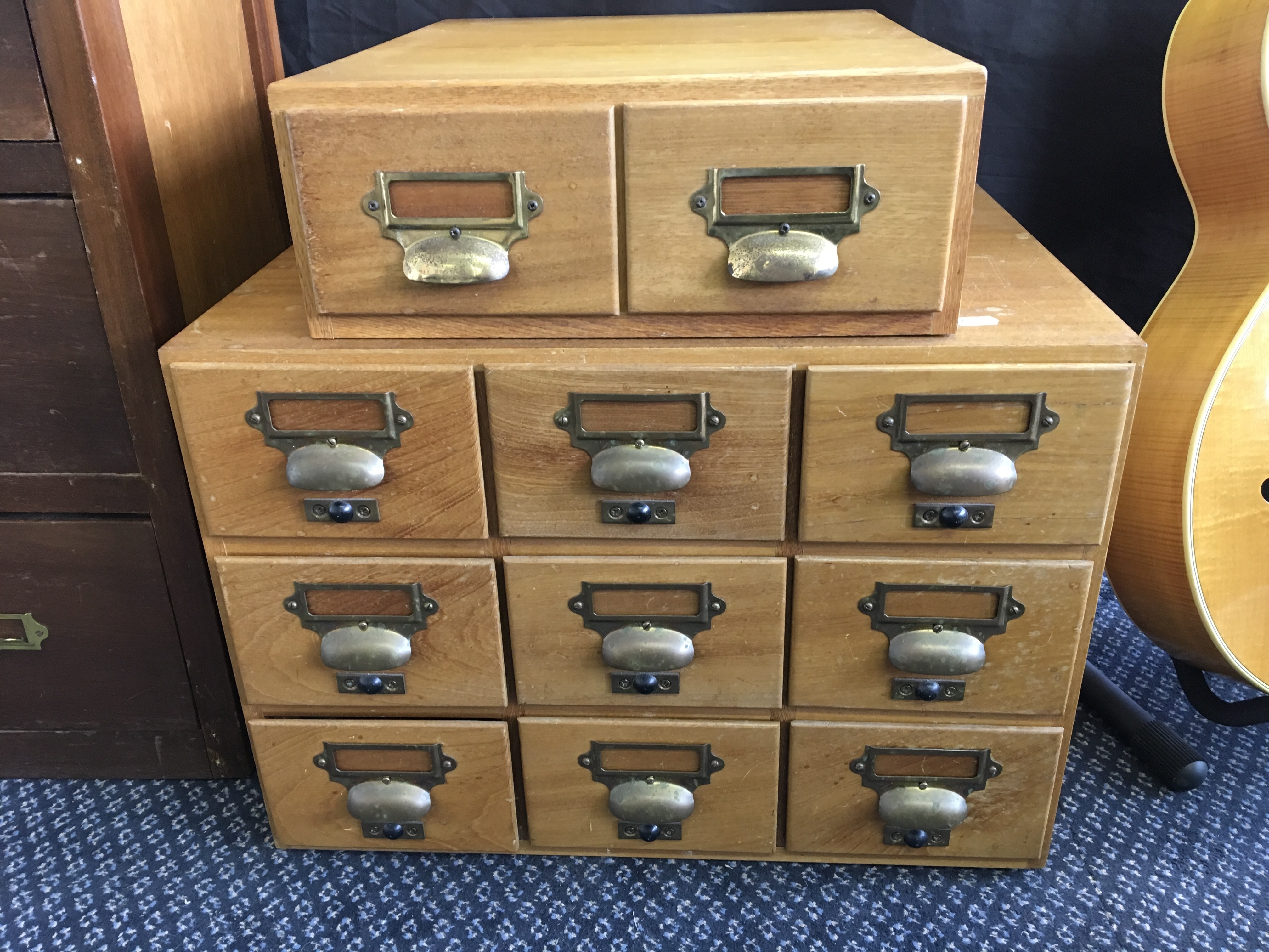Two index cabinets, one two drawer and one nine drawer.