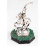 A Mappin & Webb silver horse with male rider, mounted on a black octagonal base, total height
