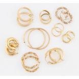 A collection of hoop earrings, to include four examples stamped 750, weight approx. 14.6g, three
