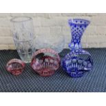 A collection of Bohemian cut glass vases and baskets.