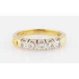 A five stone diamond ring, set with five round brilliant cut diamonds, total diamond weight