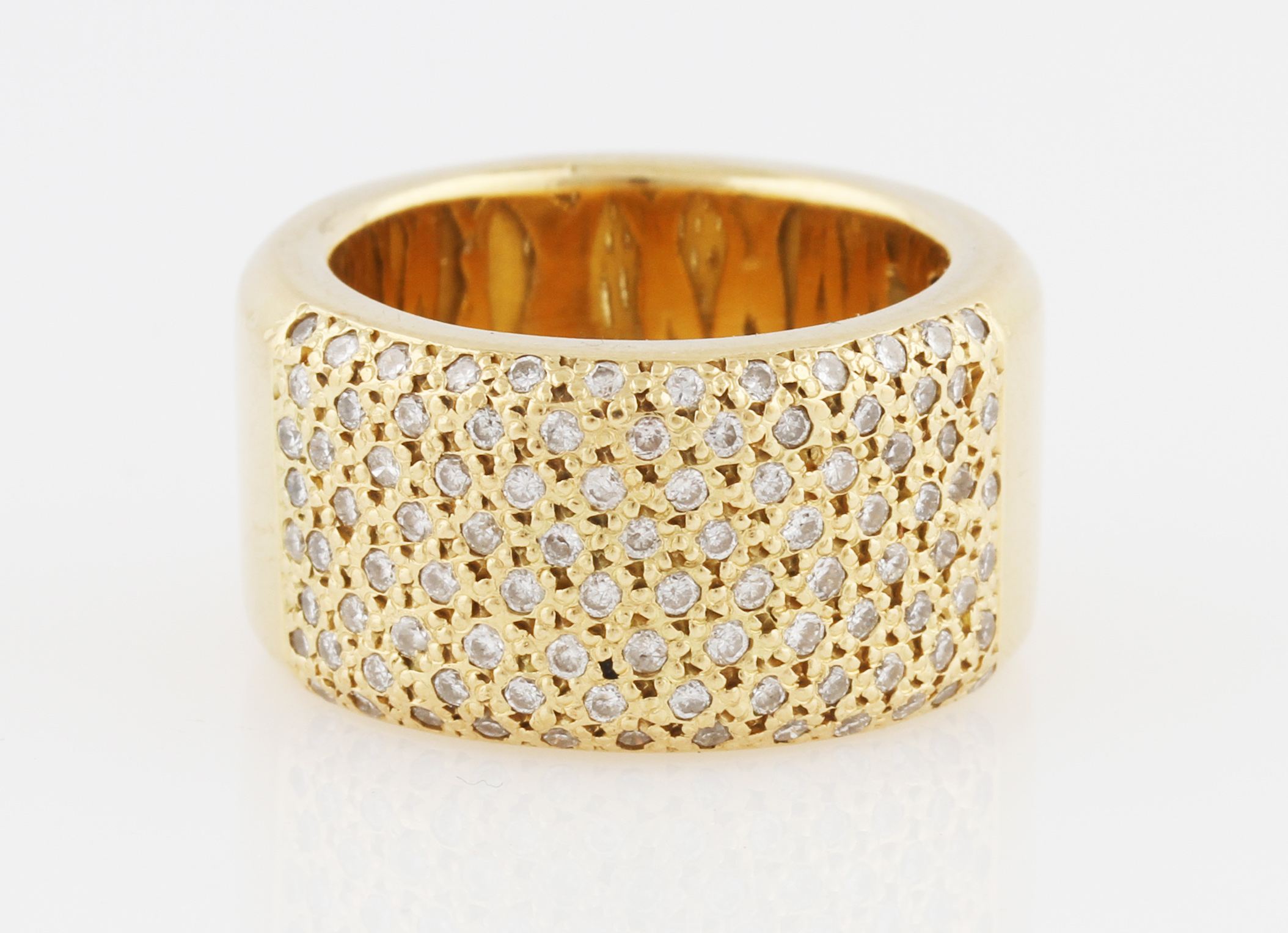 A diamond set ring, the band pave set with round brilliant cut diamond accents, yellow metal